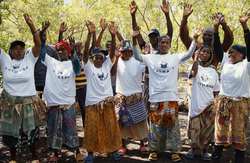 Some people celebrating a tree being planted