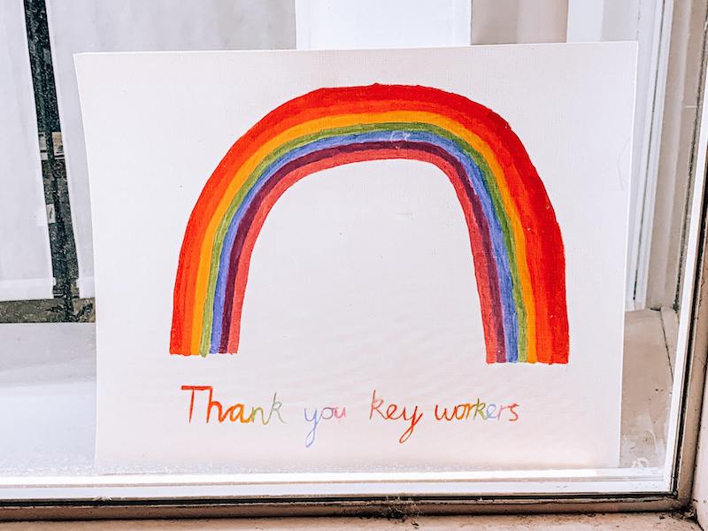 Child's colourful drawing on a rainbow accompanied by the writing: thank you key workers