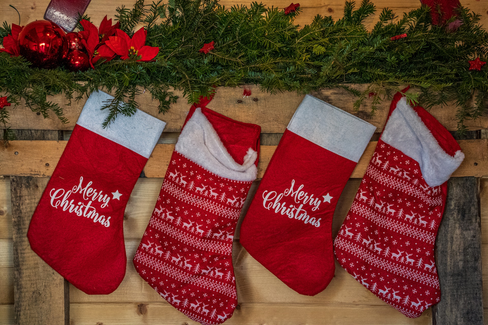 Four Christmas Stockings on a fireplace