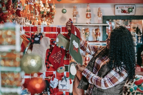 A woman shopping for Christmas stockings