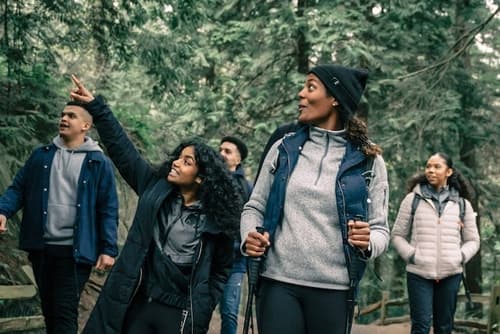A group of friends hiking in the forest
