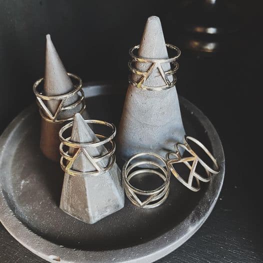 Various geometric-styled rings with triangle patterns