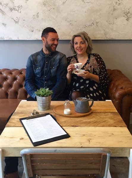 couple of people sat on an antique sofa enjoying their afternoon at Northern Tea House