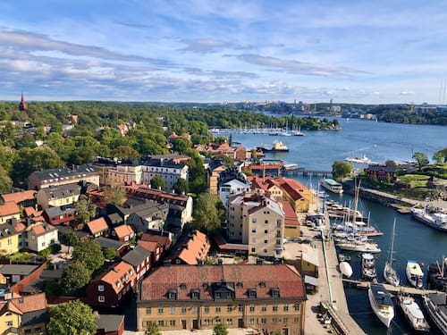 A city landscape view of Stockholm and the river.